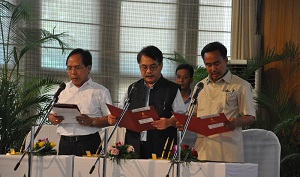 Administering the oath of newly appointed Cabinet Ministers of the State Shri Kamlong Mossang, Shri Wangki Lowang and Honchum Ngandam (from Left to Right) in  Darbar Hall, Raj Bhavan, Itanagar on 3rd August 2016.